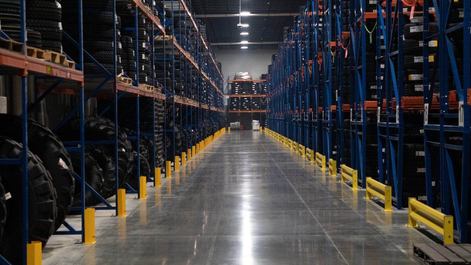 Polished warehouse floor between rows of racking